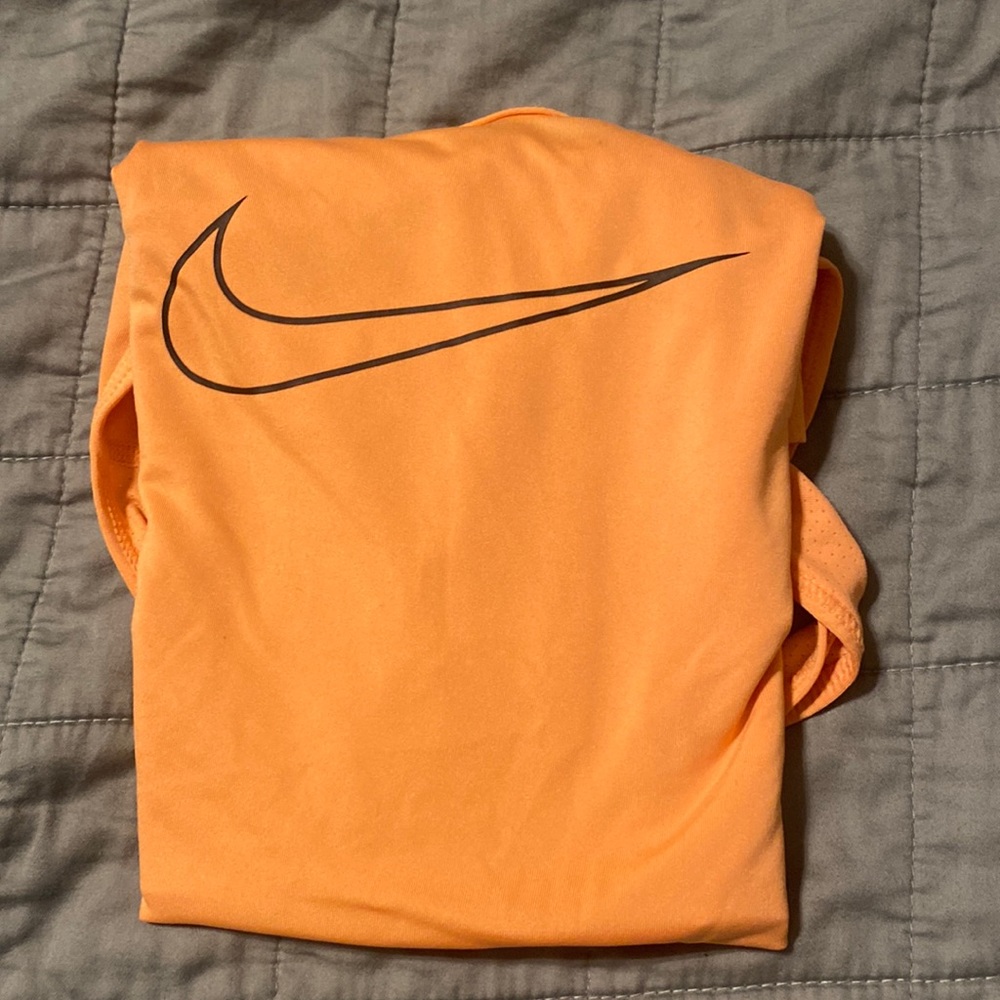 Nike swoosh training tank in light orange